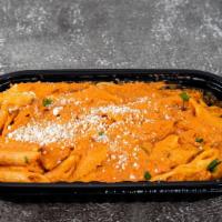 Penne Ala Vodka · Penne, vodka sauce (tomato, heavy cream, prosciutto, shallots) grated Pecorino Romano.