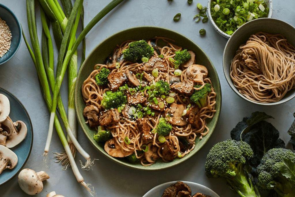 Sesame Garlic · Freshly made whole wheat noodles, roasted steak, mushrooms, broccoli, scallions, toasted sesame seeds, and our sesame garlic sauce.