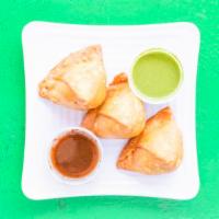 Samosa · Hand rolled pastry stuffed with potato and green peas