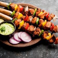 Paneer Tikka · Cottage cheese barbeccued on a skewer with onions, peppers, and tomatoes