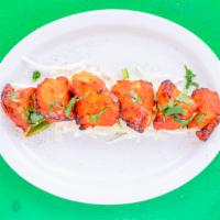 Chicken Tikka Masala · Chicken kabab in bay leaf flavored creamy tomato sauce with bell peppers and onion. Served w...