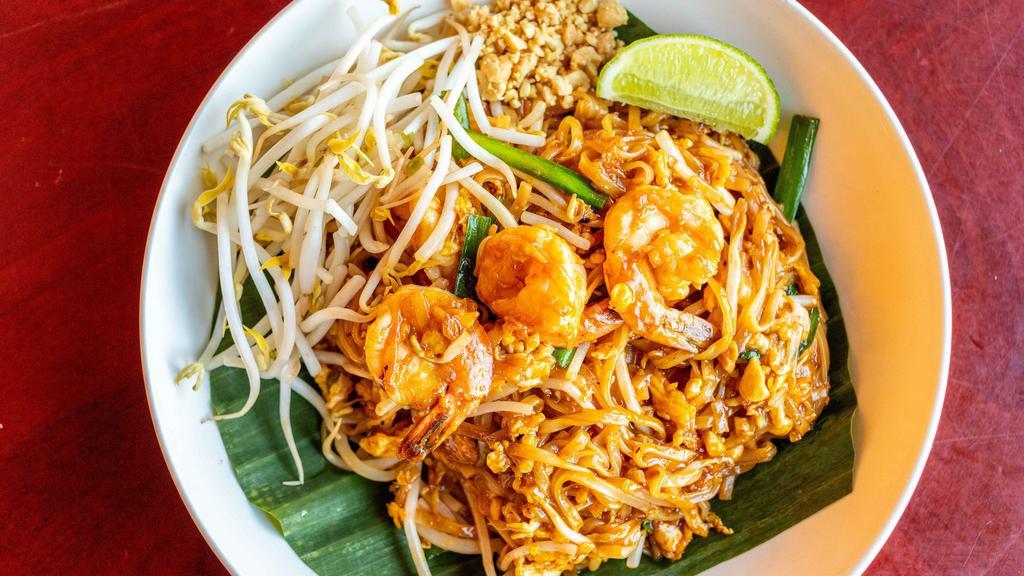 Pad Thai - Gluten Free · Traditional Thai dish of stir-fried thin rice noodles, your choice of protein, egg, crushed peanuts, bean sprouts and Asian chives, in a savory and sweet tamarind sauce.