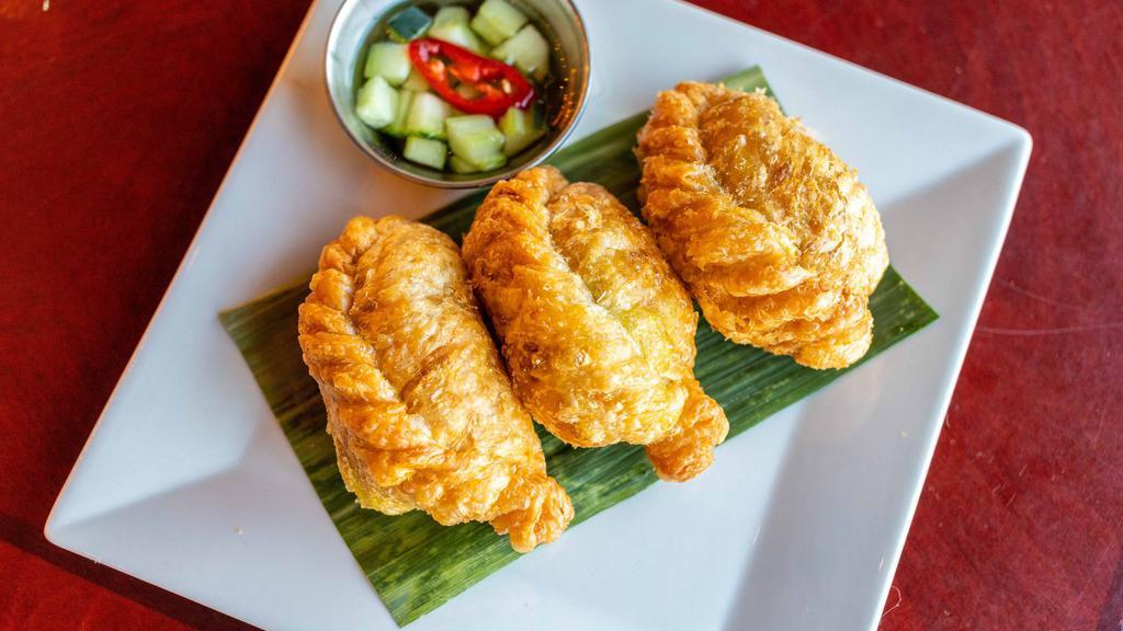 Curry Puffs · Pastries stuffed with potato, carrot, peas, corn and curry powder, served with a cucumber relish. (3 pieces)