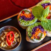 Summer Rolls · Shrimp, vermicelli noodles, cucumber, lettuce, mint, cilantro and bell pepper, wrapped in ri...