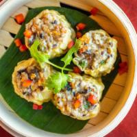 Steamed Thai Dumplings · Wontons stuffed with shrimp, ground pork, crab meat, water chestnut, wood ear mushroom, scal...