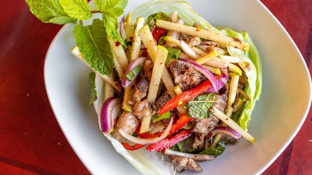 Beef Salad - Spicy · Grilled flank steak tossed with green apple, shallot, bell pepper, mint and toasted rice, served under a chili lime vinaigrette.