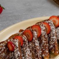 Challah French Toast · Served with butter syrup and a dusting of powdered sugar