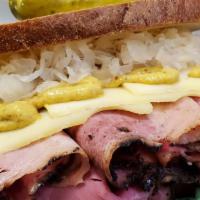 The Reuben · Your choice of Hot Pastrami, Turkey or Corned Beef with melted swiss, coleslaw and Russian d...