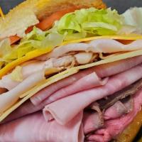 Americana · Ham, turkey, roast beef, American and swiss cheese, lettuce, tomatoes, and coleslaw.
