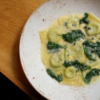 Ravioli Della Casa · housemade spinach and ricotta ravioli, butter and sage sauce, grated Parmigiano-Reggiano