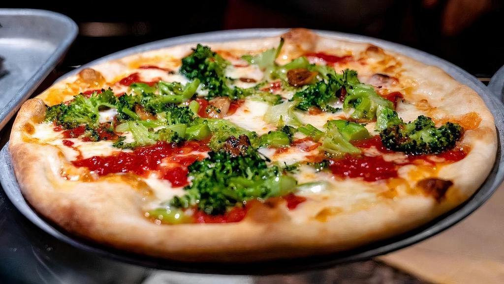 Margherita Pizza · Plum tomatoes, garlic, fresh mozzarella and basil.
