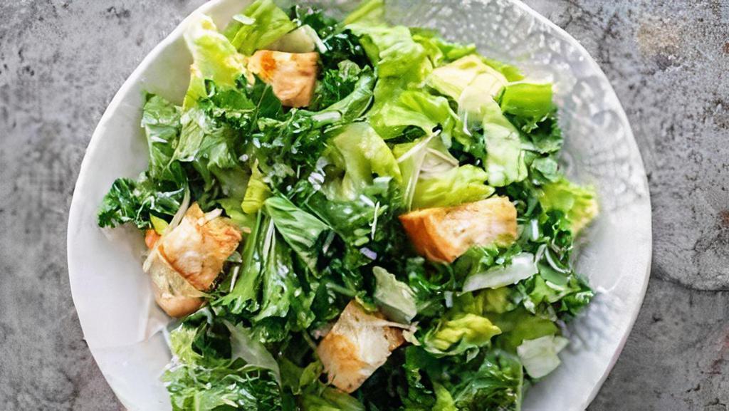 Kale Caesar Salad · Massaged kale, Parmesan cheese and croutons with house made caesar dressing