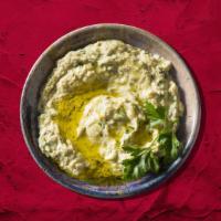 Baba Ganoush Daddy · A blend of fresh Char-Grilled eggplant, blended with tahini, garlic, lemon juice, and parsley