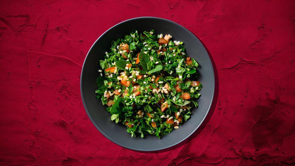 Tabouli Parsley Salad · Finely chopped parsley with tomatoes, onion, mint with burgul, lemon juice and olive oil