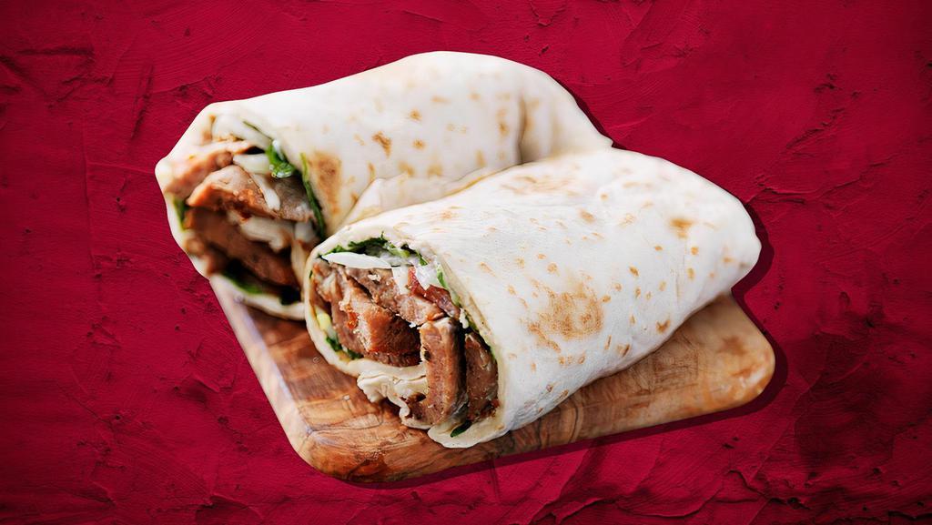 Lamb Kabob Wrap Sandwich  · Fine ground house-seasoned lamb patties with chopped onions, lettuce, tomatoes, cabbage, and pickles. Topped with our special house sauce and wrapped to perfection.