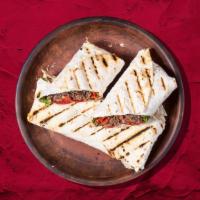 Signature Beef Shawarma Wrap · House special char-grilled beef shawarma wrapped to perfection.