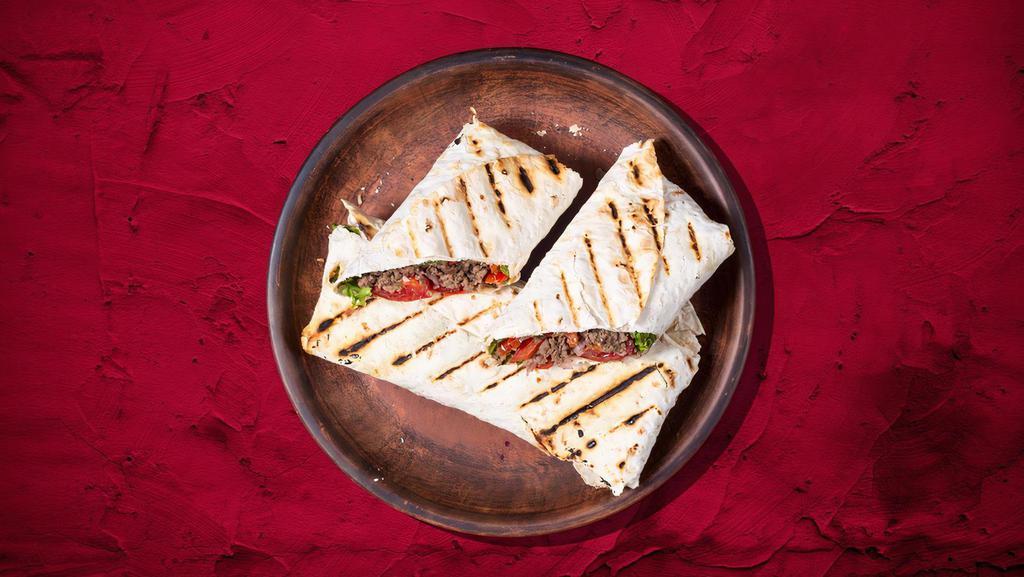 Signature Beef Shawarma Wrap · House special char-grilled beef shawarma wrapped to perfection.