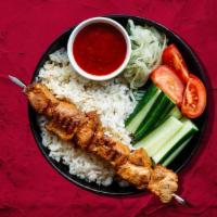 Chicken Kebab Plate Champion · Tender cuts of chicken marinated with our signature spice mix, served with house rice, steam...