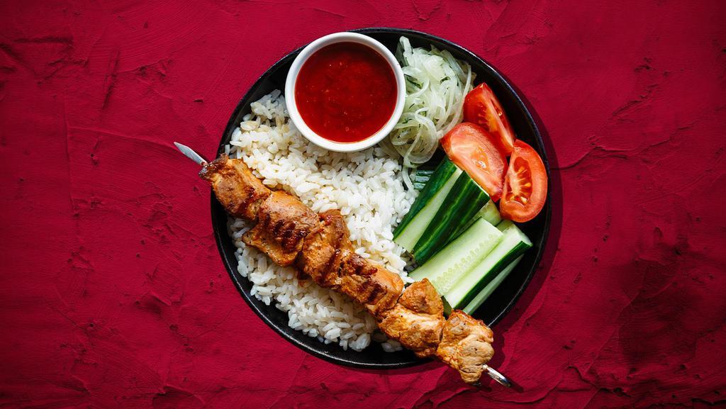 Chicken Kebab Plate Champion · Tender cuts of chicken marinated with our signature spice mix, served with house rice, steamed fresh mixed vegetables and salad