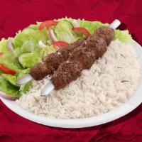 Char Grilled Lamb Kebab Dinner · Marinated lamb cubes charbroiled to perfection, served with house rice, steamed fresh mixed ...
