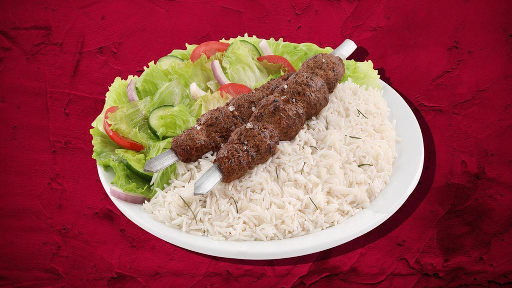 Char Grilled Lamb Kebab Dinner · Marinated lamb cubes charbroiled to perfection, served with house rice, steamed fresh mixed vegetables and salad