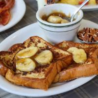 Bananas Foster French Toast · Challah French toast with classic bananas foster sauce and chopped pecans served on the side.