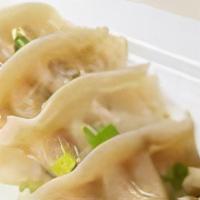 Thai Dumplings · Steamed wontons stuffed with chicken  served with sweet black soy sauce.