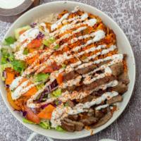 Chicken And  Gyro Combo Over Rice Bowl · Take your taste Buds to a journey of ancient Greece with Juicy Beef Gyro and grilled Chicken...