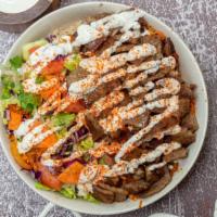 Gyro Over Rice Bowl  · Served with Gyro, Rice, Lettuce, and Tomatoes along with your Favorite Toppings and White an...