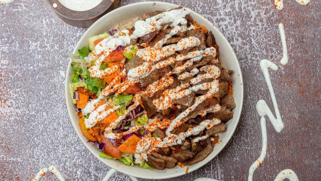 Gyro Over Rice Bowl  · Served with Gyro, Rice, Lettuce, and Tomatoes along with your Favorite Toppings and White and Hot Sauce. Ingredients: Beef, Rice, Lettuce, Tomatoes, Cucumbers and Yogurt. 
All our products are Halal.