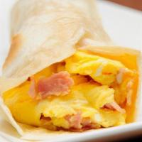 Classic Egg Wrap · Delicious Breakfast wrap topped with Ham, Two Eggs, Cheese & Home Fries. Served on customer'...