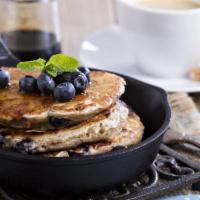 Blueberry Pancakes · 3 Buttery pancakes cooked to perfection and topped with fresh blueberries.