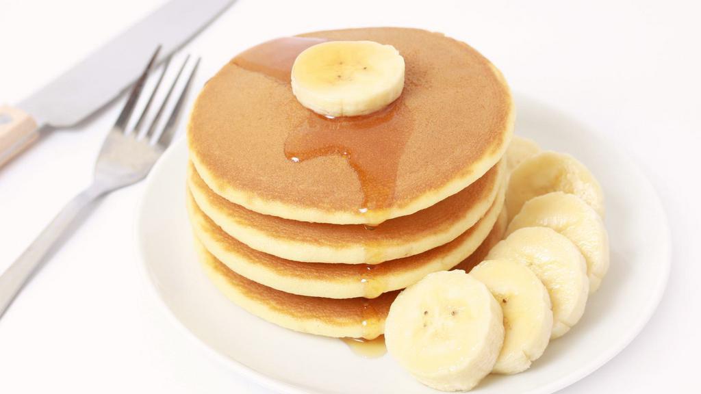 Pancakes With Banana Slices · 3 Buttery pancakes cooked to perfection and topped with fresh banana slices.