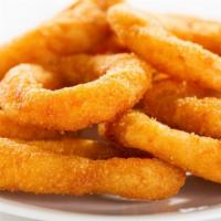 Onion Rings · Golden-crispy onion rings salted to perfection.