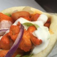 Chicken Gyro · Served with salad and sauce.