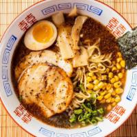 Tonkotsu Shoyu Black Garlic Ramen · House-made savory pork bone noodle soup with soy sauce. Toppings comes with braised chashu, ...