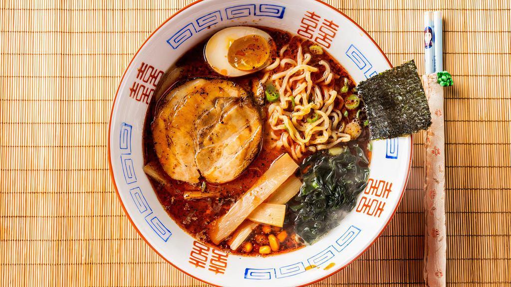 Korean Kimchi Ramen · House-made savory pork bone spicy kimchi soup based with toppings comes with braised chashu, marinated egg, green onions, wakame, nori, bamboo shoots, corn, and Korean kimchi.