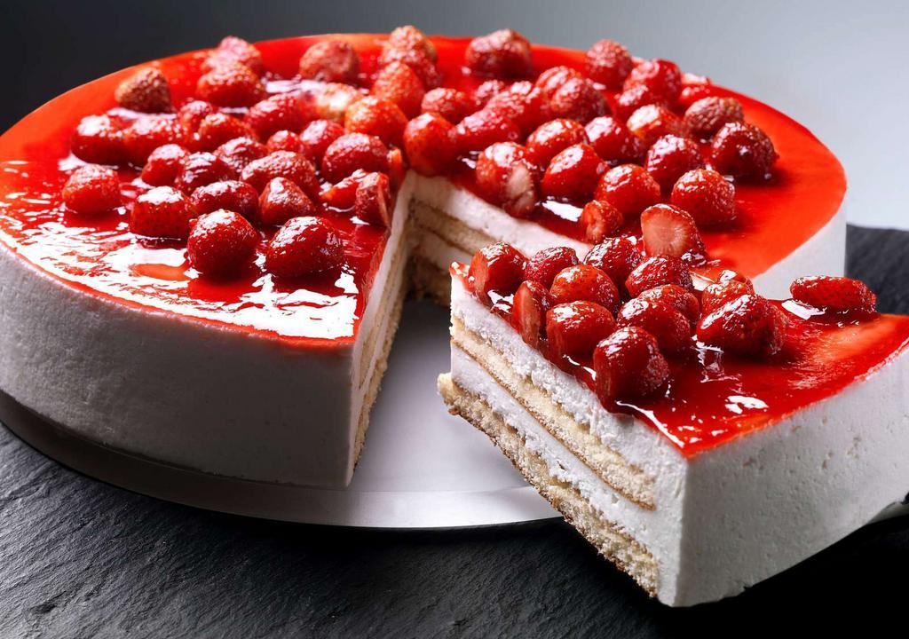 Monterosa (Slice) · A creamy mix of mascarpone and ricotta cheese, divided by a delicate layer of sponge cake, topped with wild strawberries.
