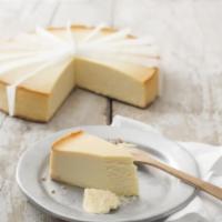 New York Cheese Cake (Slice) · Traditional New York cheesecake flavored with a hint of vanilla, on a sponge cake base.