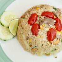 Tropical Pineapple Fried Rice · Pineapple, tomato, garlic, cashew nut, onion and egg.
