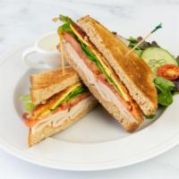 Turkey Club · Served with House Salad. Turkey breast, bacon, tomato, lettuce, and mayo.
