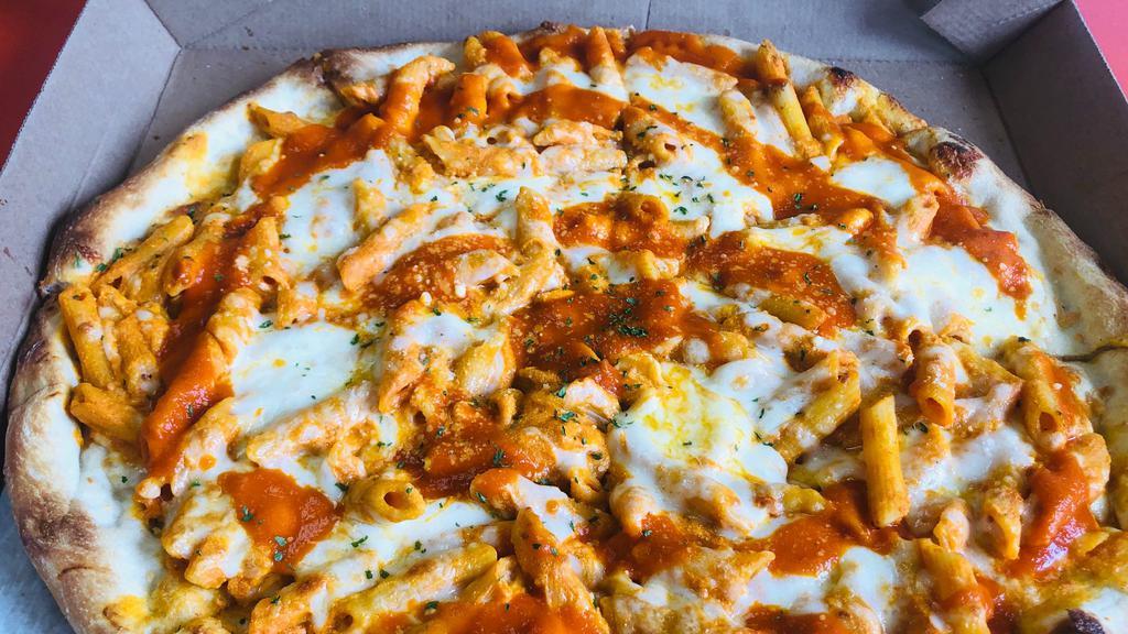 Baked Ziti Pizza · Topped with penne pasta mixed with tomato sauce, ricotta, and mozzarella cheese.