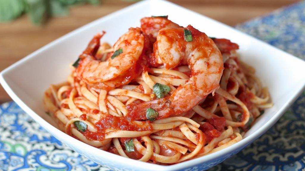 Shrimp Fra Diavolo · Clams, mussels, and spicy marinara sauce over linguini.