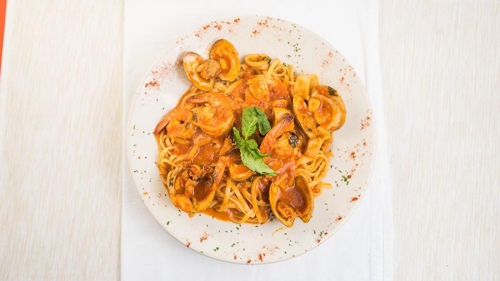 Linguini Di Mare · Clams, shrimp, mussels, and calamari tossed over linguini pasta.