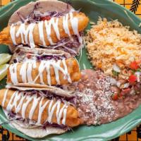 Baja Fish Tacos · Cod filets are dipped in beer batter, fried, and served in corn tortillas with shredded cabb...