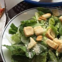 Caesar Salad · Romaine lettuce topped with our classic dressing, croutons, and grated cheese