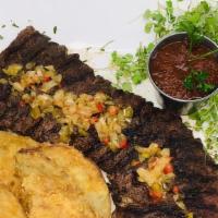 Mofongo De Churrasco · Skirt steak mofongo served with salad and our special mofongo meat sauce. Cheese is NOT incl...