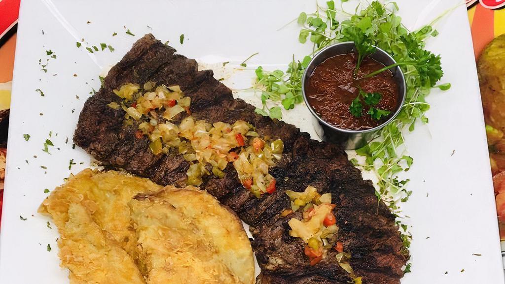 Mofongo De Churrasco · Skirt steak mofongo served with salad and our special mofongo meat sauce. Cheese is NOT included.