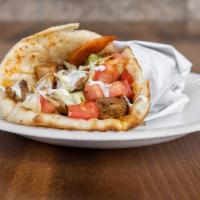 Chicken Gyro Wrap · Slightly spicy Chicken gyro wrapped in pita bread with lettuce, tomato, onions and white sau...