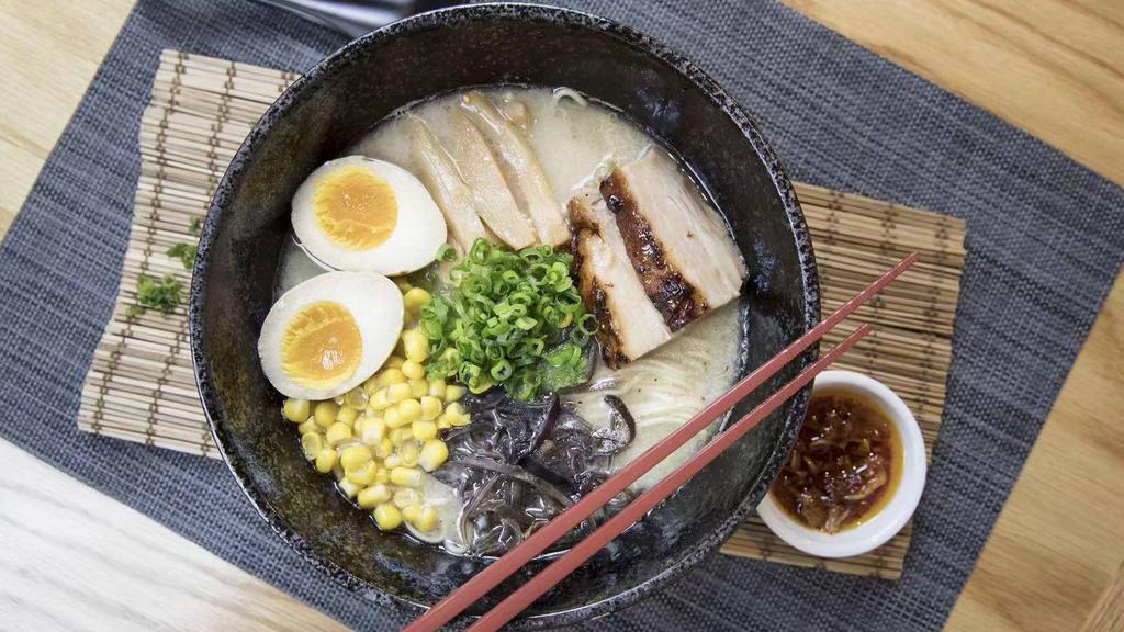 Tonkotsu Ramen · Pork broth, bamboo, wood ear mushroom, corn, scallion, soy sauce marinated  egg, roasted pork, white thin noodle.